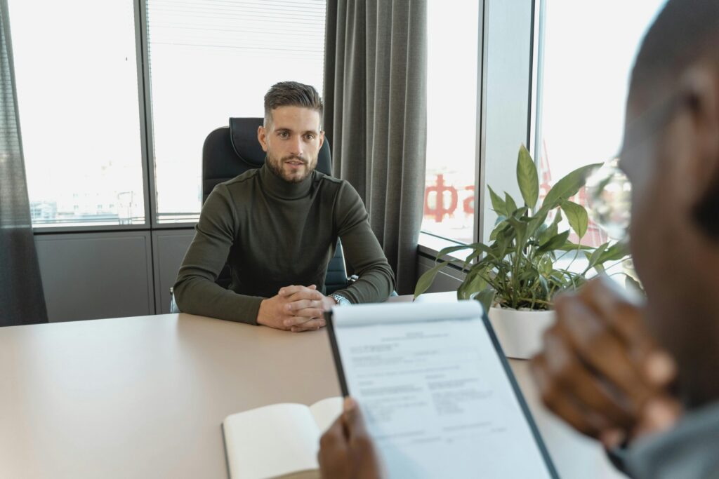 Two people in a Supreme Concepts Inc. job interview