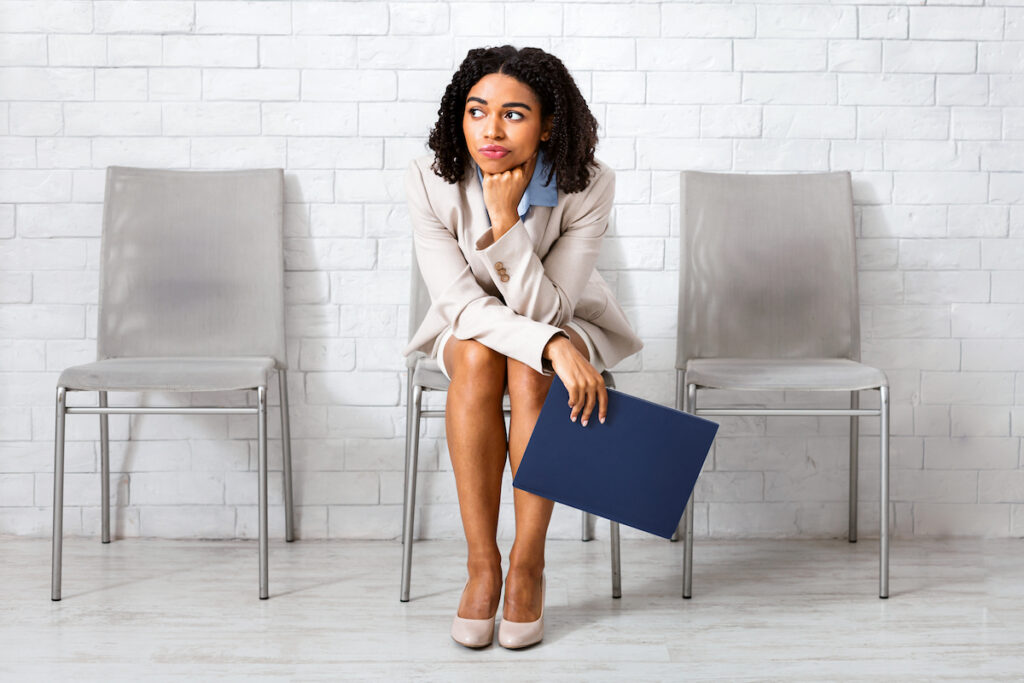A young woman waiting for the decision on her Supreme Concepts job application